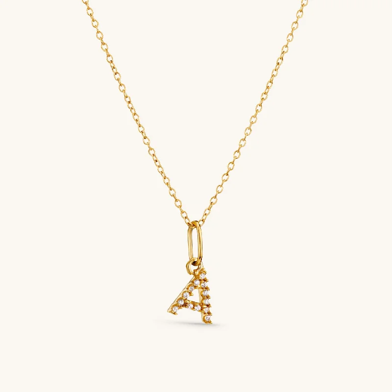 A Crystal Initial Necklace in Gold